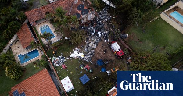 Brazil plane crash: authorities try to identify victims as bodies recovered